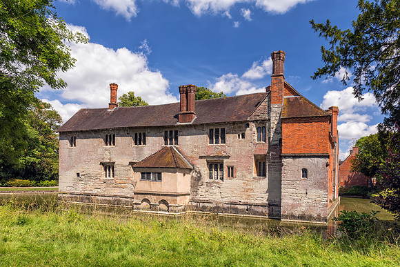 A rear view of Baddesley Clinton Manor House showing the moat, July 2017